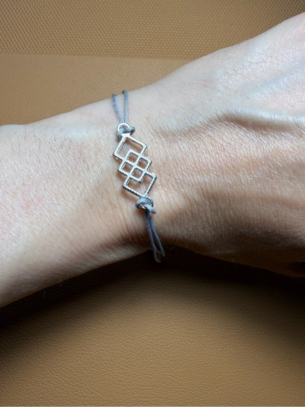 Silver Tone Endless Love Knot Cord Bracelet - Grey Blue